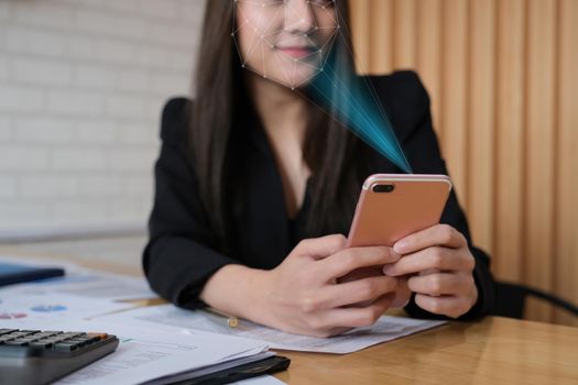 A businesswoman completes KYC using an online banking program in order to open a digital savings account. The definition of cyber security.