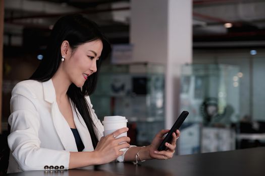 A businesswoman completes KYC using an online banking program in order to open a digital savings account. The definition of cyber security.