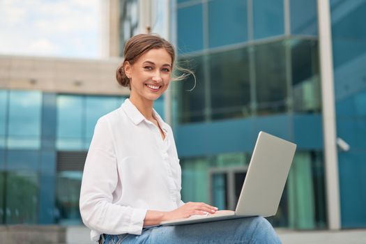 Businesswoman laptop successful woman business person outdoor corporate building exterior Pensive elegance caucasian professional business woman middle age ecommerce deal Online banking