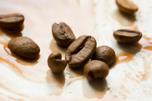 Coffee beans closeup. Sprinkled coffee