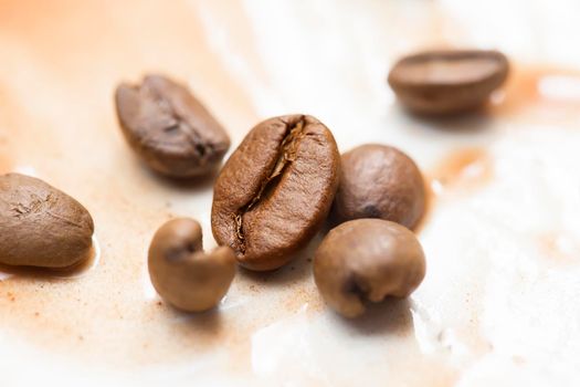 Coffee beans closeup. Sprinkled coffee