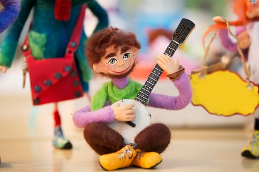 Belarus, Gomel, October 2, 2017. Central market. A figurine is a toy of a guitarist. Toys made of wool