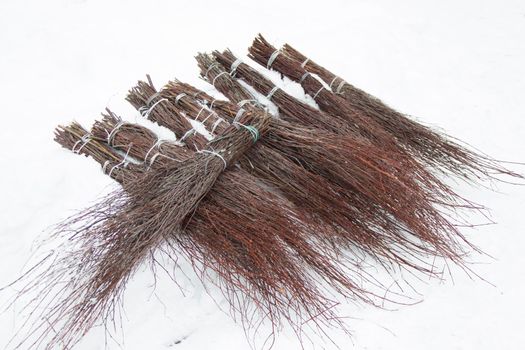 Many brooms from dry tree branches.Besom