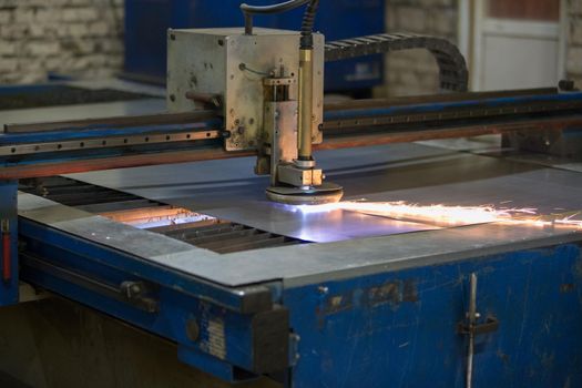 Plasma cutting of metal.Cutting of metal. Sparks fly from laser