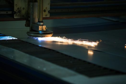 Plasma cutting of metal.Cutting of metal. Sparks fly from laser