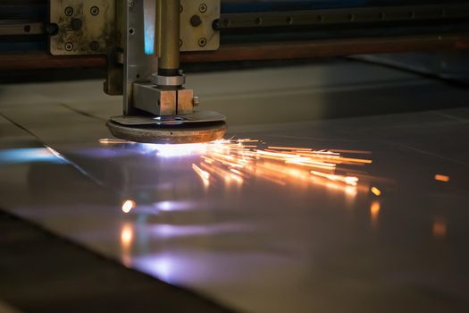Plasma cutting of metal.Cutting of metal. Sparks fly from laser
