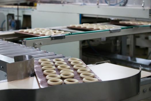 Industrial line for the production of biscuits and bagels. Conveyor belt for the production of culinary products