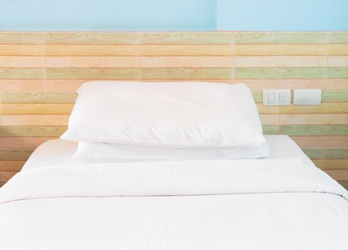 bed and  bedspread pillow white in in bedroom