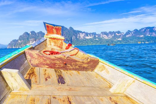 Wooden boat on sailing travel in Ratchaprapa Dam and Cheow Larn Lake, Khao Sok nature beautiful in Thailand