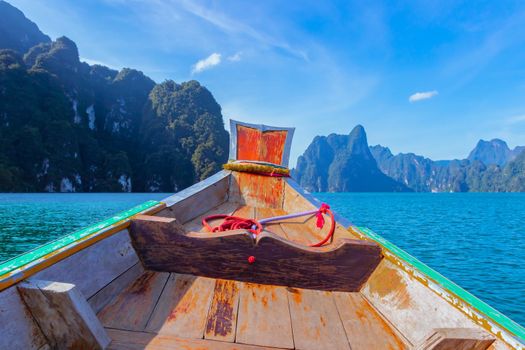 Wooden boat on sailing travel in Ratchaprapa Dam and Cheow Larn Lake, Khao Sok nature beautiful in Thailand