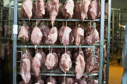 Meat factory.The fillet suspended on a rope in the drying chamber of the meat processing plant