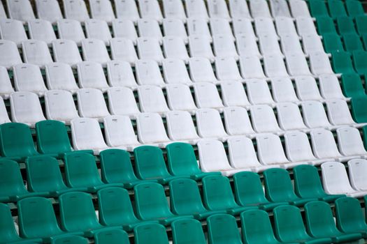 Spotting chairs in the stadium.Places for fans