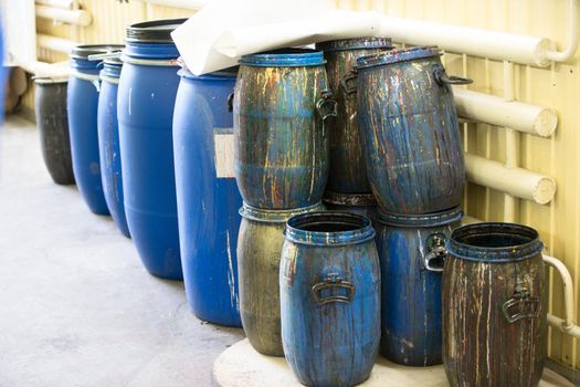 Plastic barrels with paint