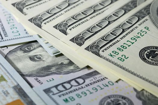 One hundred dollar bills folded in a fan. A lot of dollars