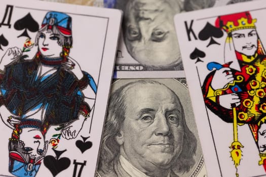 Dollars and playing cards close-up