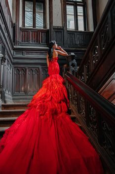 Woman Vintage Red Dress Old Castle Beautiful Princess In Seductive Dress Elegant Caucasian Female Fairy Tale story Dark Stairs