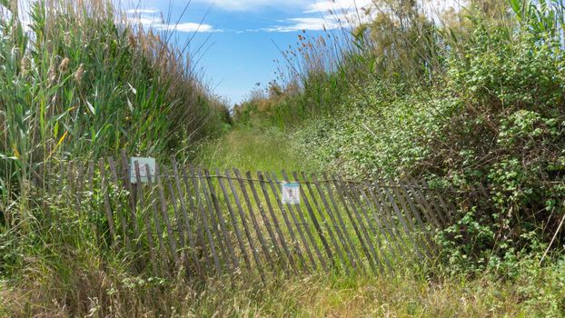 Wooden doors forbidding the passage natural park on the outskirts of the city of barcelona in spain