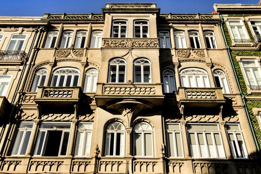 Beautiful and old colorful tiled facades in Porto city in January