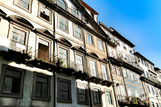 Beautiful and old colorful tiled facades in Porto city in January