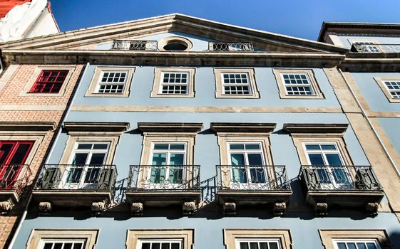 Beautiful and old colorful tiled facades in Porto city in January