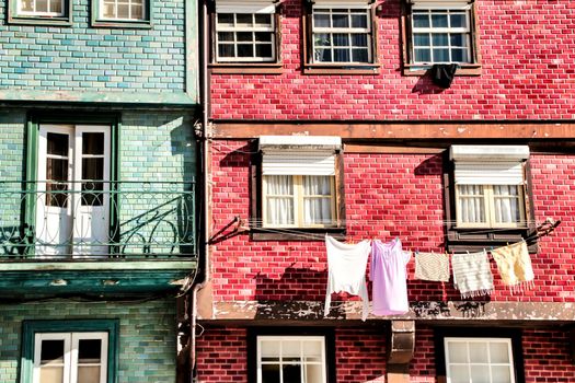Beautiful and old colorful tiled facades in Porto city in January