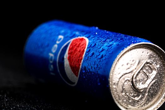 Editorial photo of Pepsi can with water droplets on black background. Studio shot in Bucharest, Romania, 2021