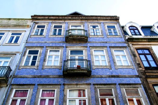 Beautiful and old colorful tiled facades in Porto city in January