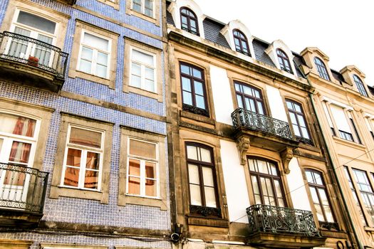 Beautiful and old colorful tiled facades in Porto city in January
