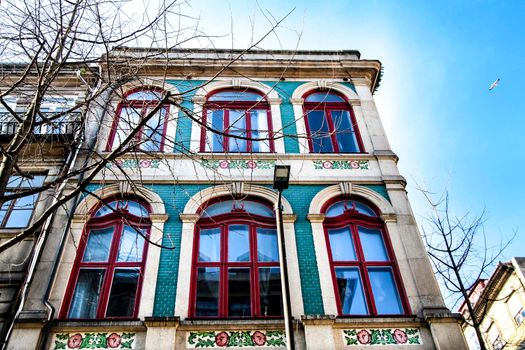 Beautiful and old colorful tiled facades in Porto city in January