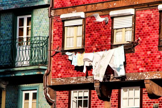Beautiful and old colorful tiled facades in Porto city in January