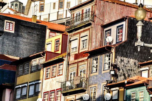 Beautiful and old colorful tiled facades in Porto city in January