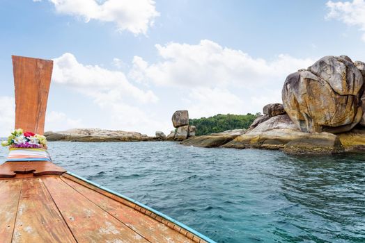 Ko Hin Sorn and prow of the boat travel in summer, is a small island with stone overlap uncannily, tourist attractions near Koh Lipe at Tarutao National Park in the Andaman Sea, Satun, Thailand