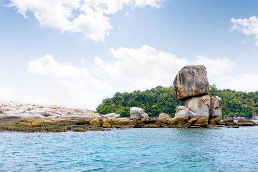 Beautiful nature landscape of Ko Hin Sorn small island with surprisingly overlap rocks in the Andaman Sea and sky in summer attractions near Koh Lipe at Tarutao National Park, Satun, Thailand