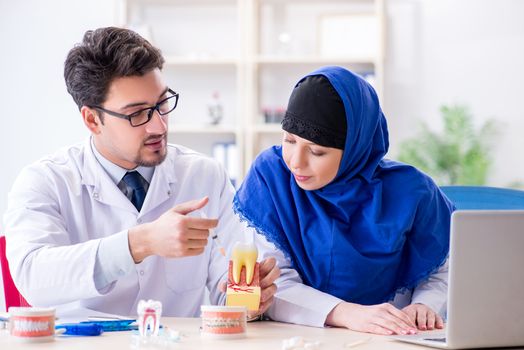 Dentist doctor and assistant working on new tooth implant