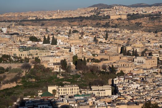 Fes Morocco cityscape with medina in centre seen from hills above in bright sun . High quality photo