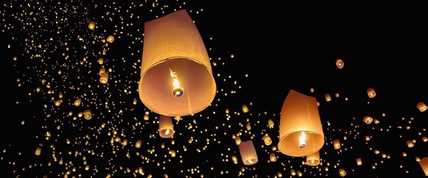 Tourist floating sky lanterns in Loy Krathong festival , Chiang Mai ,Thailand.