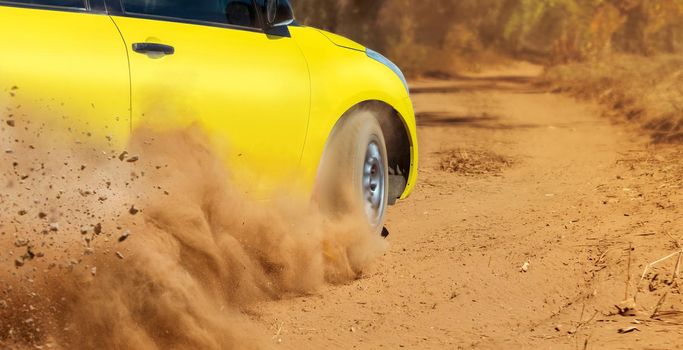 Rally racing car on dirt track.