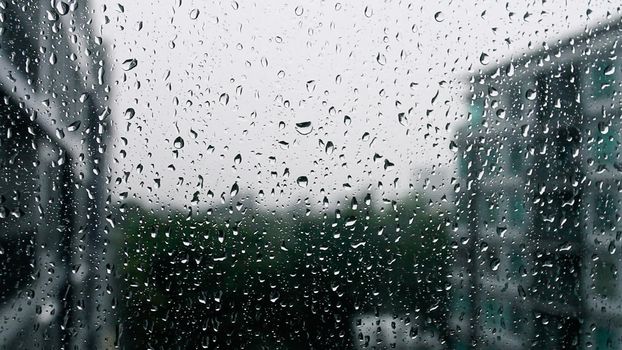 Drops of rain on a window pane, Torrential rain day.