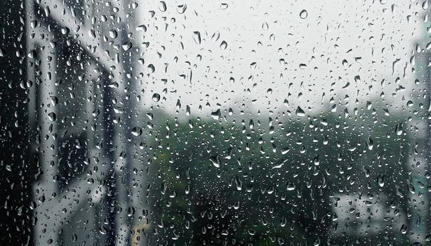 Drops of rain on a window pane, Torrential rain day.