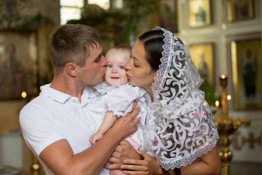 Belarus, the city of Gomil, June 20, 2019. City church.Family with baby in church. Parents with a child in an Orthodox church