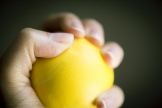 Exercises with one hand and yellow physiotherapy ball