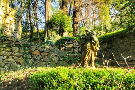 Oporto, Portugal- January 6, 2020: Stone statue in the Idyllic Crystal Palace Garden in Oporto, Portugal
