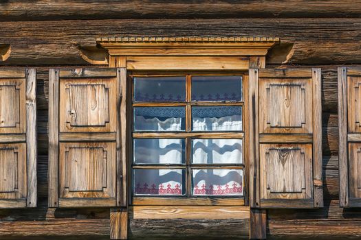 Window in historical wooden house in Open air museum in Semenkovo, Russia