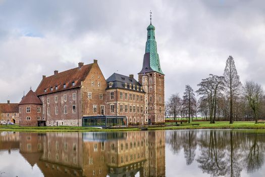 Water castle Raesfeld in Muensterland, North Rhine-Westphalia, Germany. View with lake