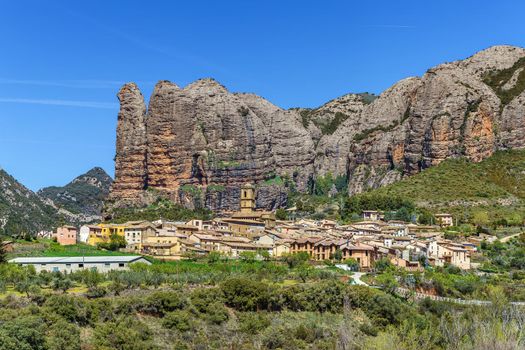 View of Aguero village and Los Mallos mountains behind it, Aragon, Spain