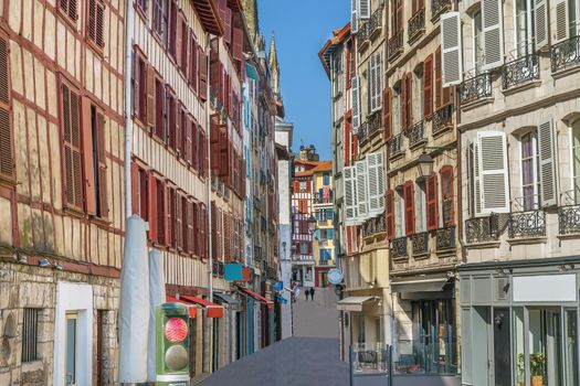 Street with historical houses in Bayonne city center, France