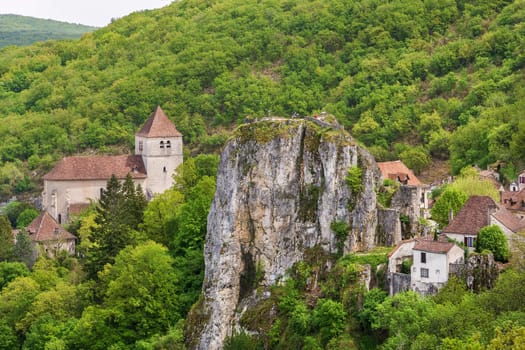 View of Saint-Cirq-Lapopie with rock, France