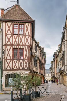 Street with historical half-timbered houses in Dijon, France