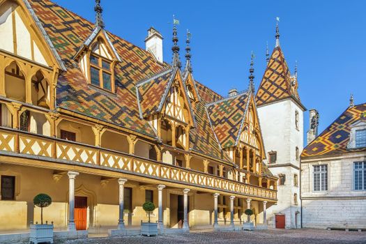 Hospices de Beaune or Hotel-Dieu de Beaune is a former charitable almshouse in Beaune, France. Courtyard, internal facade with polychrome roof