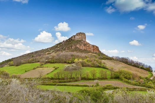 Rock of Solutre (French: Roche de Solutre), is a limestone slope 8 km west of Macon, France